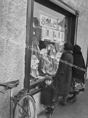 WINDOW SHOPPERS AT SALE